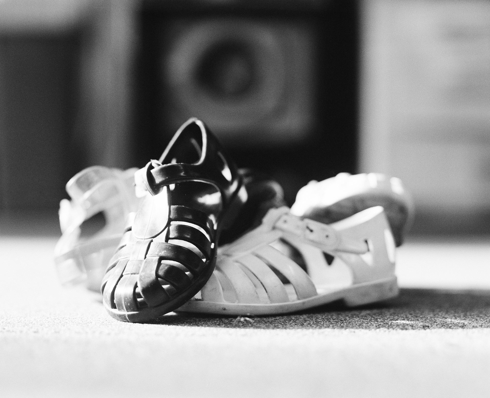 "Left alone toddler jelly shoes", Cambridge, 2020 120mm black and white film. Diane-Laure Mussy.