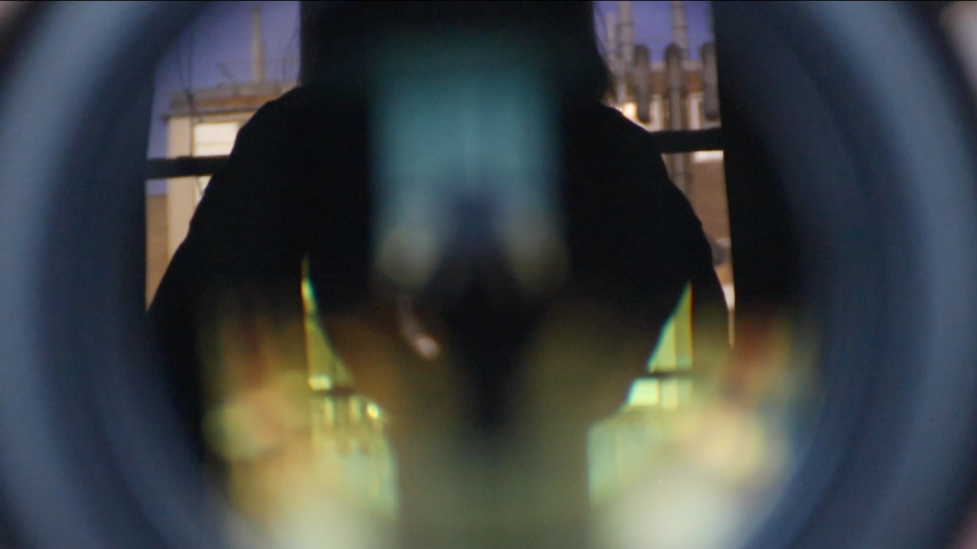 Still from "Kameroscope" (2021): the camera films a mirror, capturing a distortion of reality created by the reflection of the lens itself.