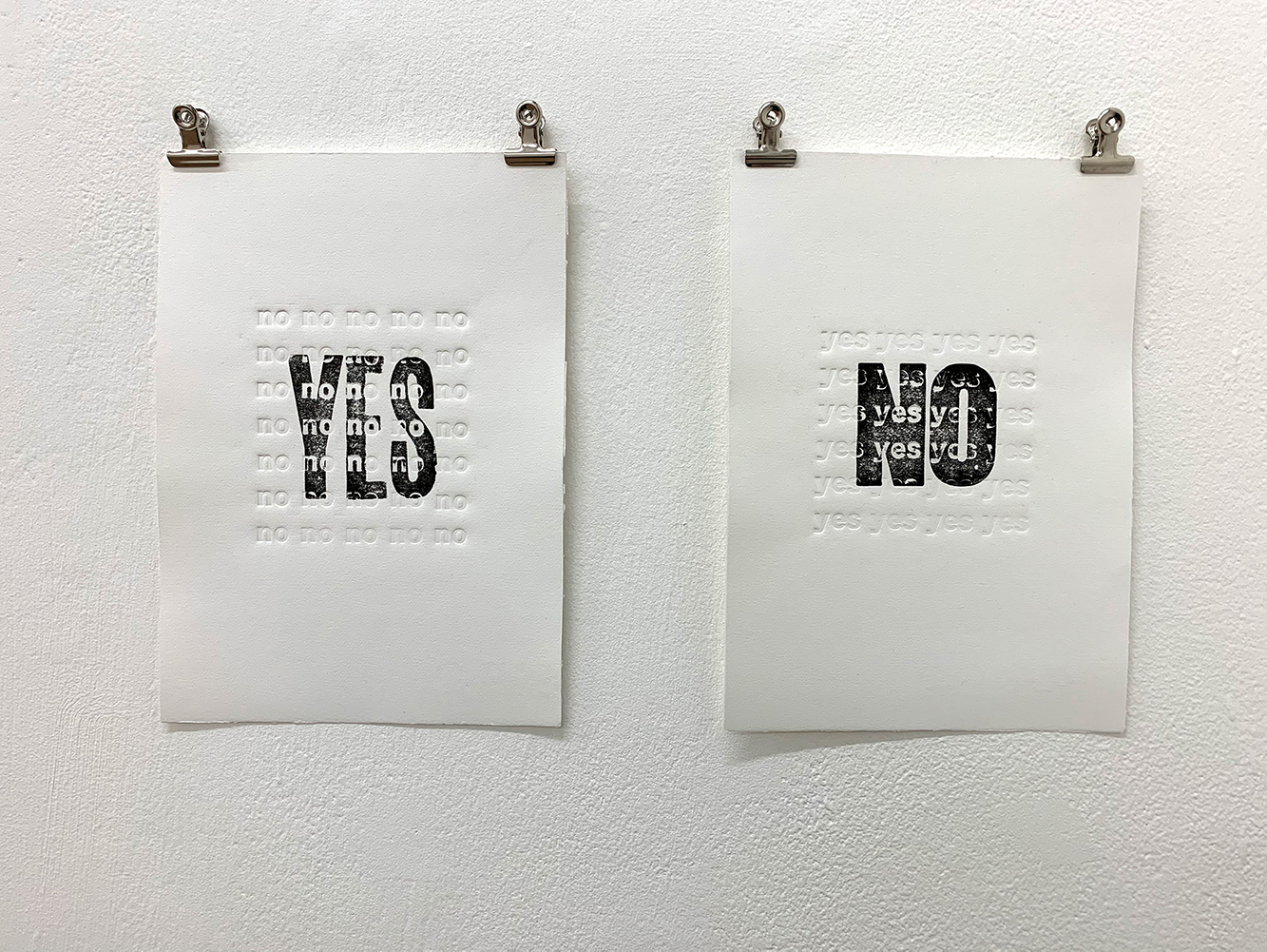 Installation Shot. Yes/No 16.6x23.3 (each work). Letterpress and embossing on paper.